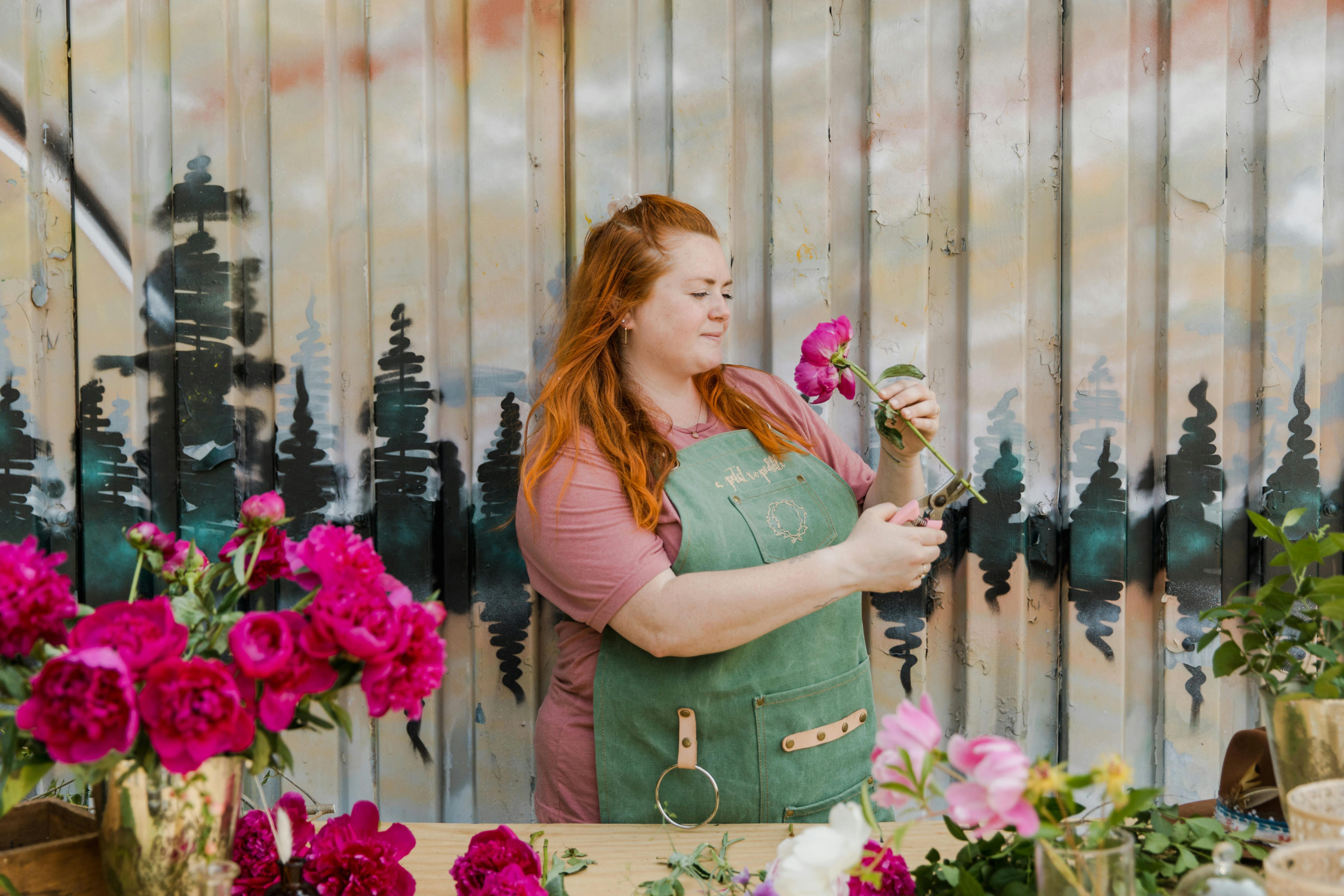 A Woman Holding Pink Flower